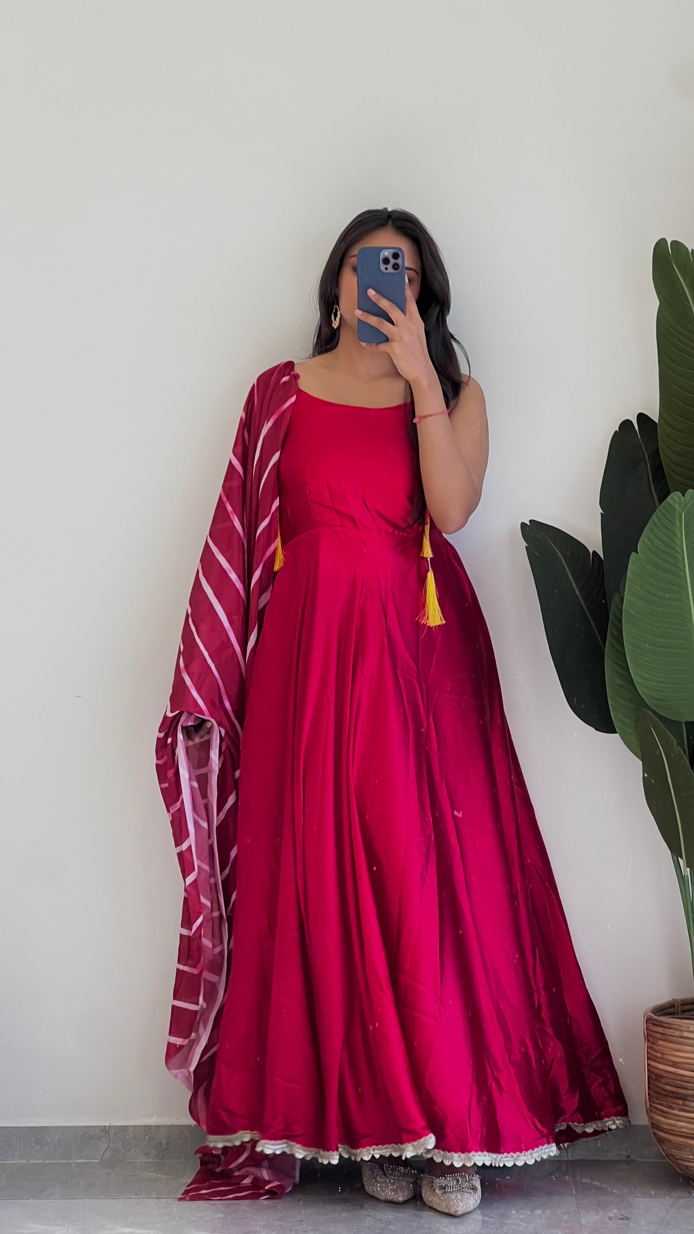 This red suit features a stunning Leheriya print dupatta , Elevate your look and make a statement with this unique and vibrant suit.