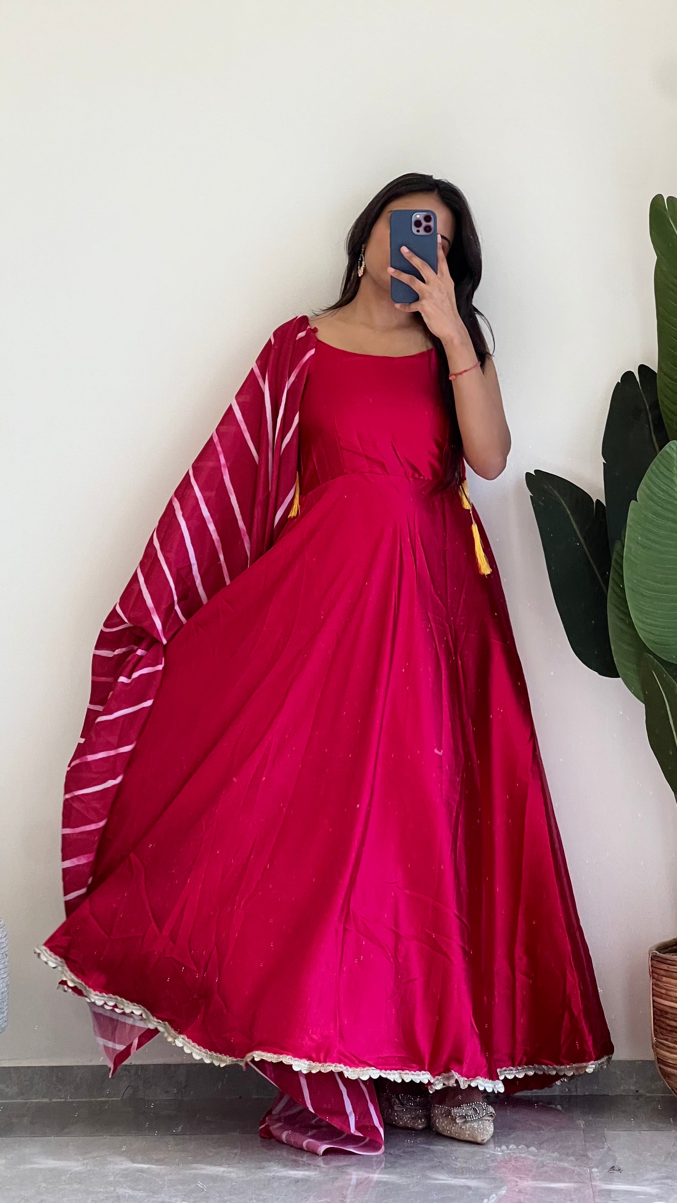 This red suit features a stunning Leheriya print dupatta , Elevate your look and make a statement with this unique and vibrant suit.