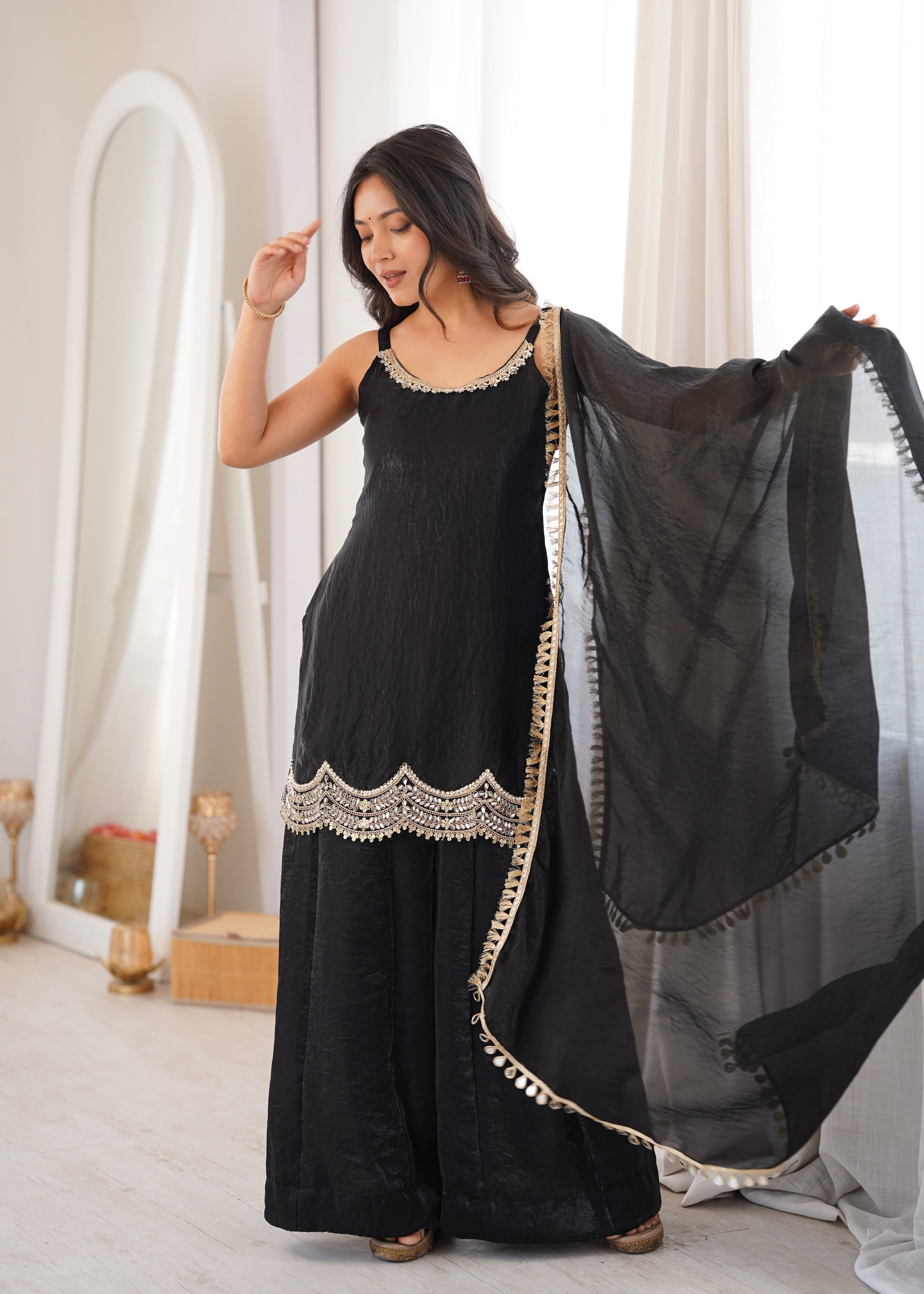 Effortless black glam with scallop-border charm.