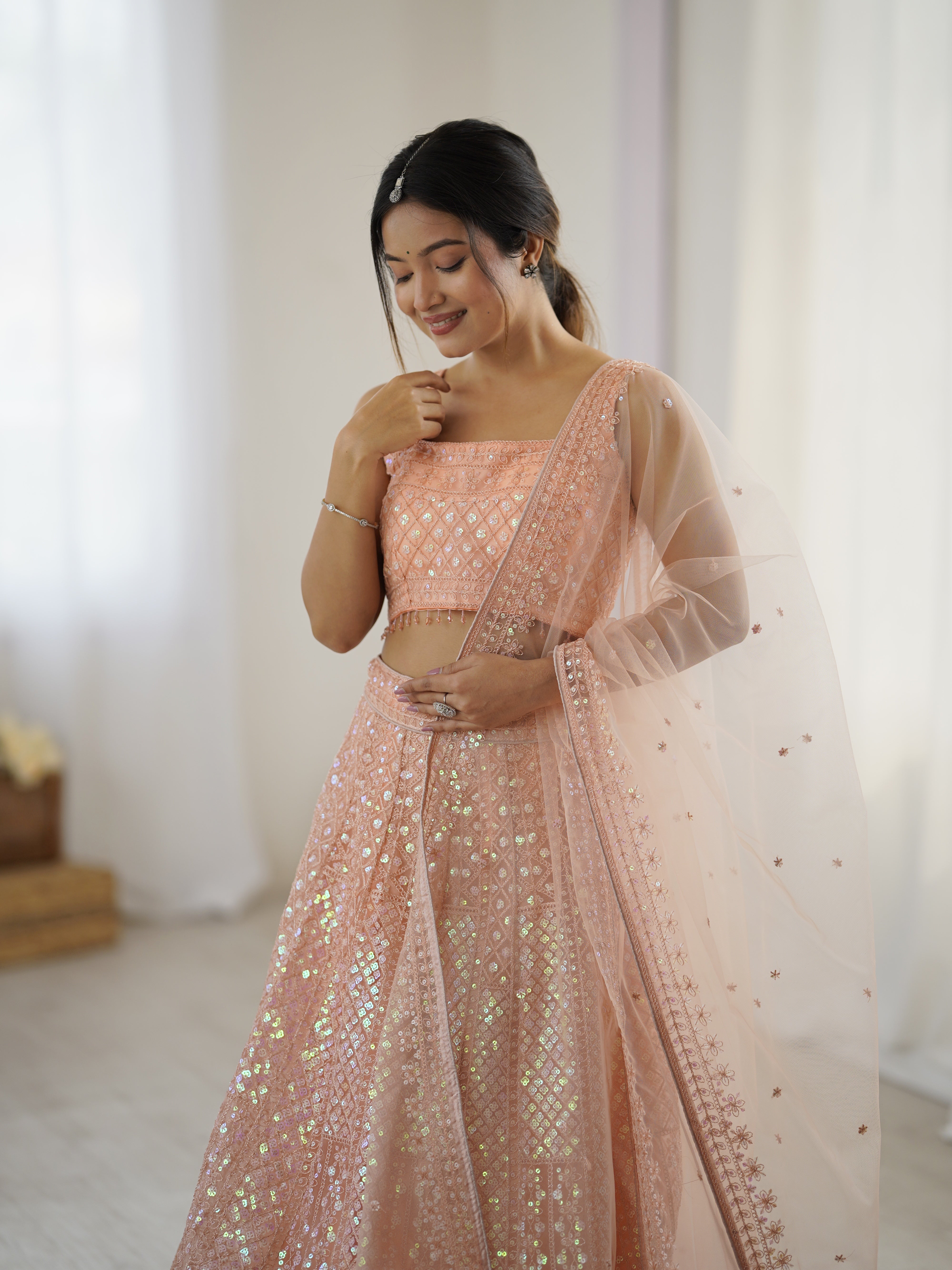 Sparkling Peach Net Lehenga Set