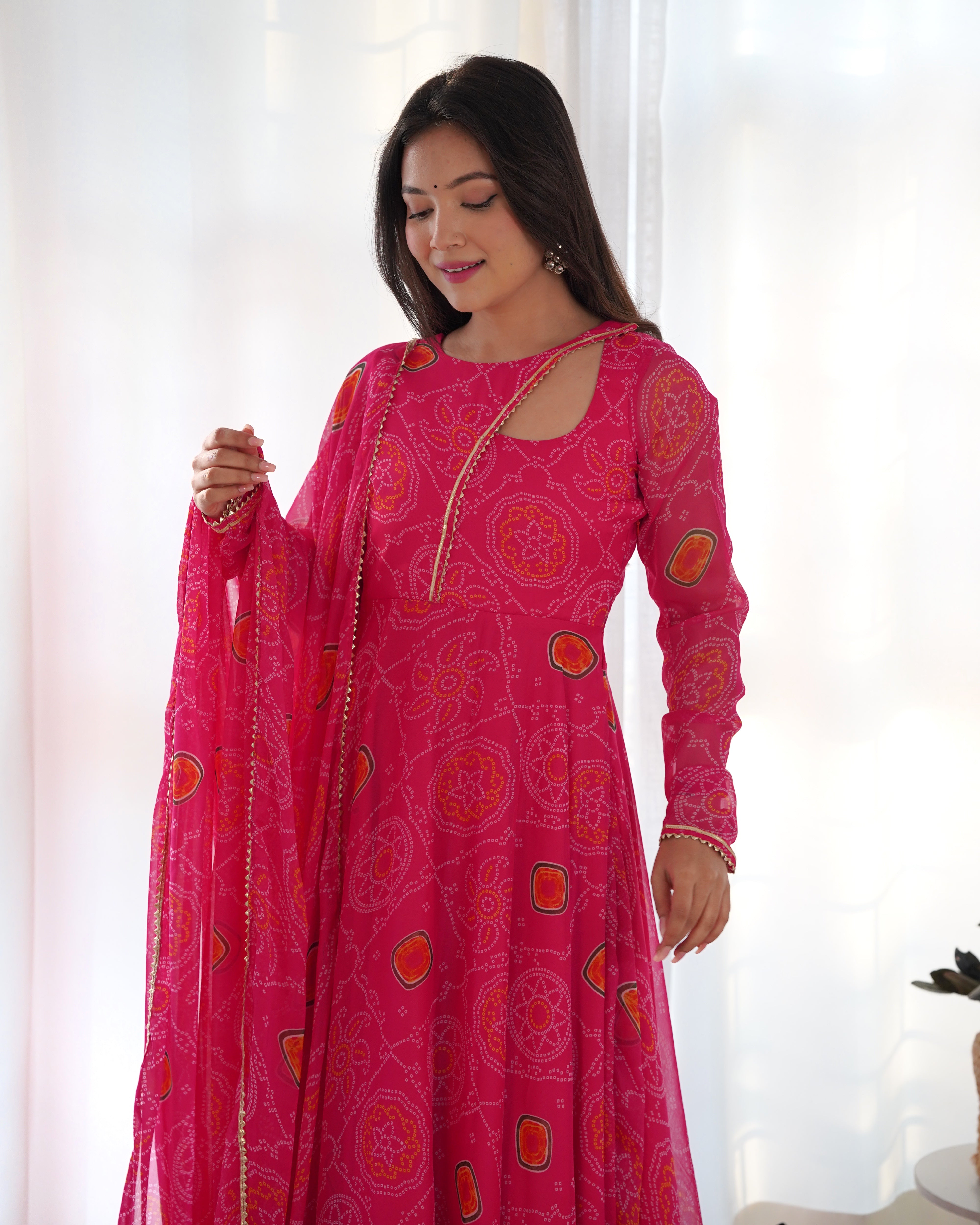 Elevate your style with this stunning and timeless Bandhej Anarkali Gown