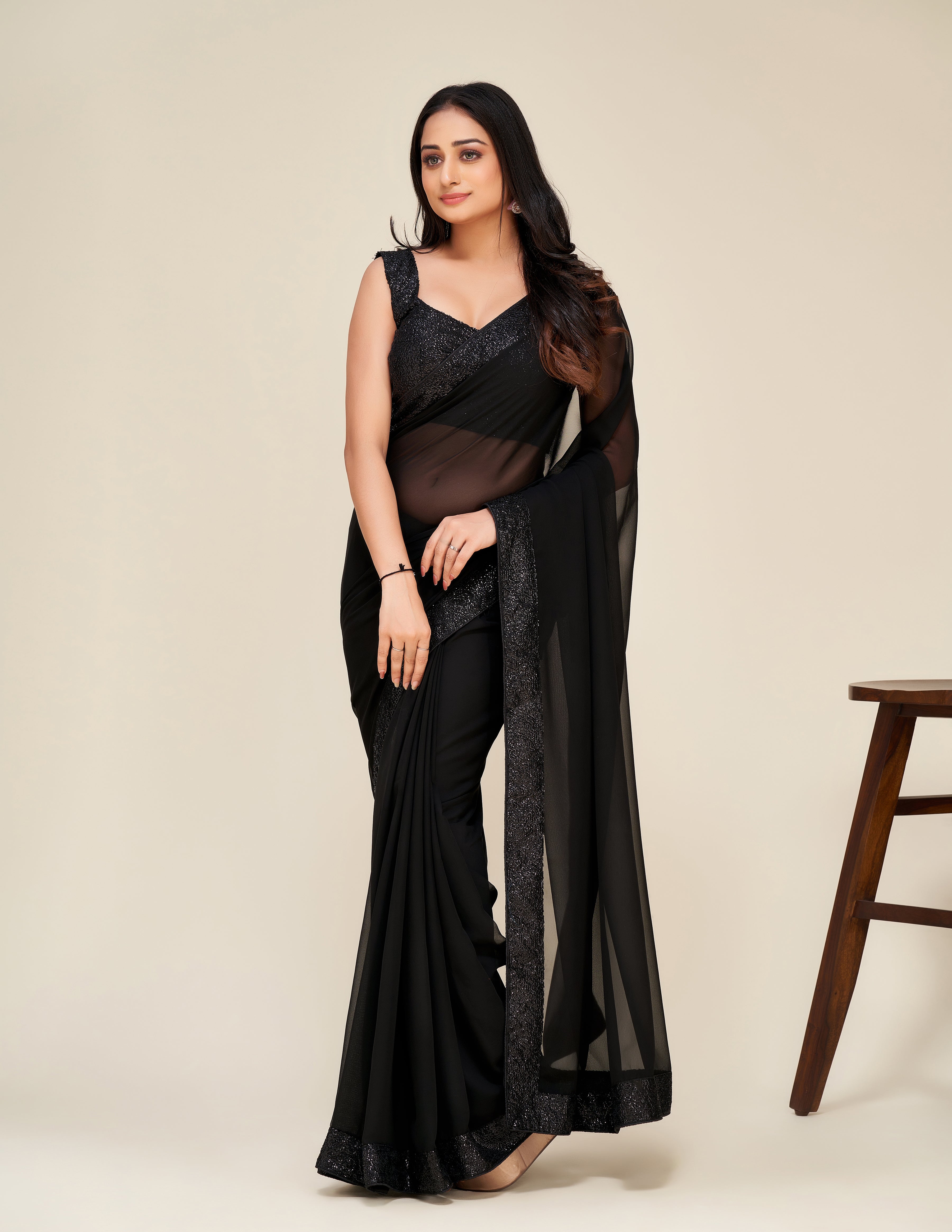 Upgrade your wardrobe with our Designer black saree.