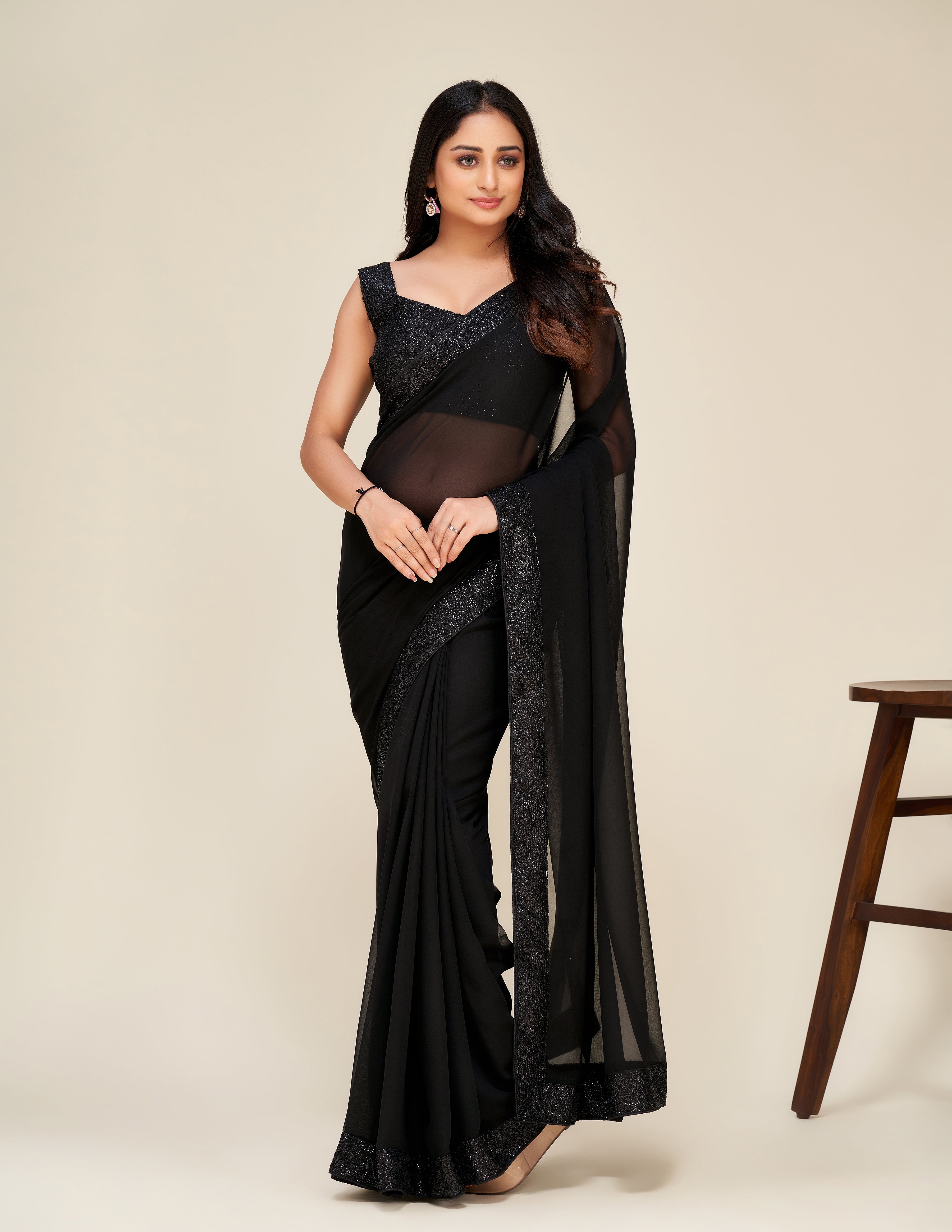 Upgrade your wardrobe with our Designer black saree.