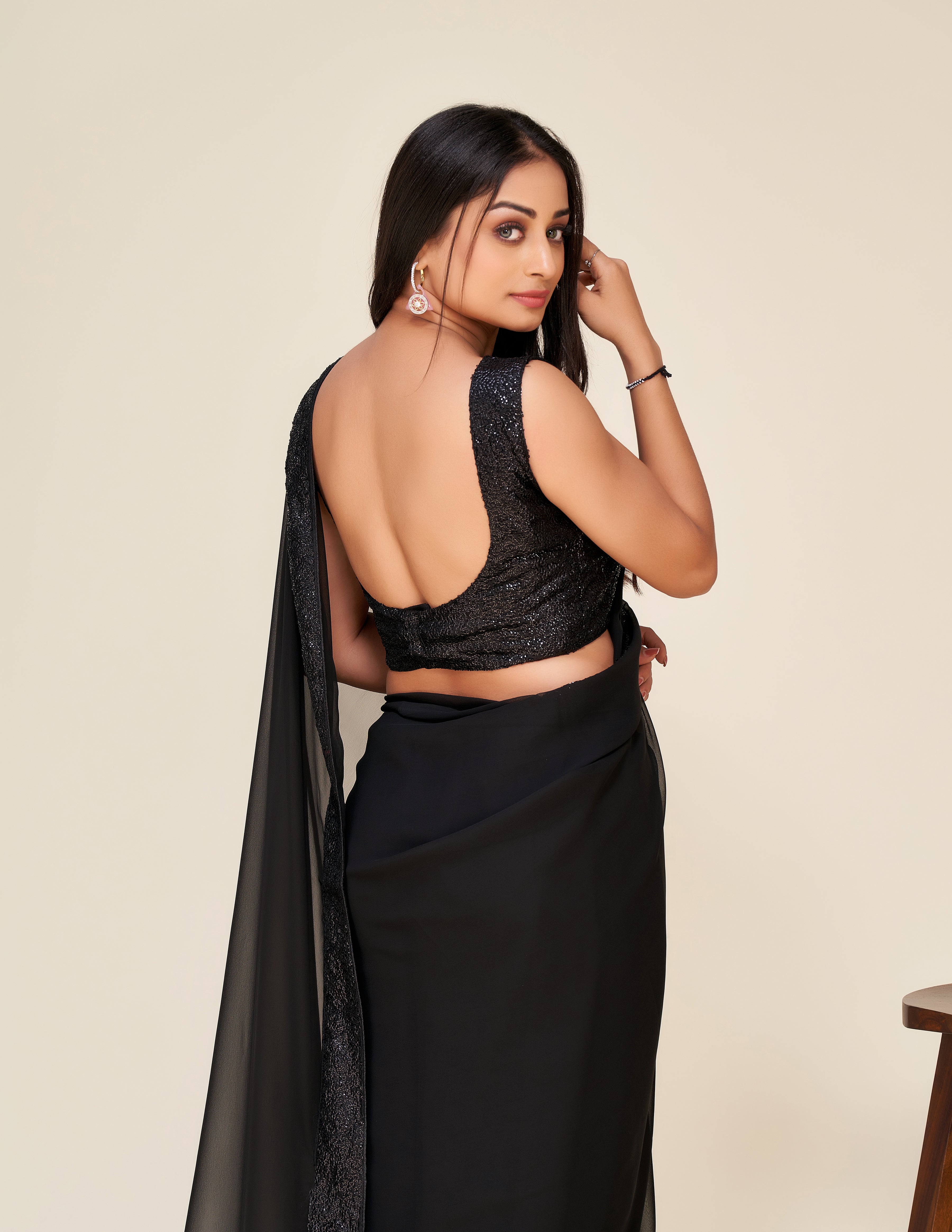 Upgrade your wardrobe with our Designer black saree.