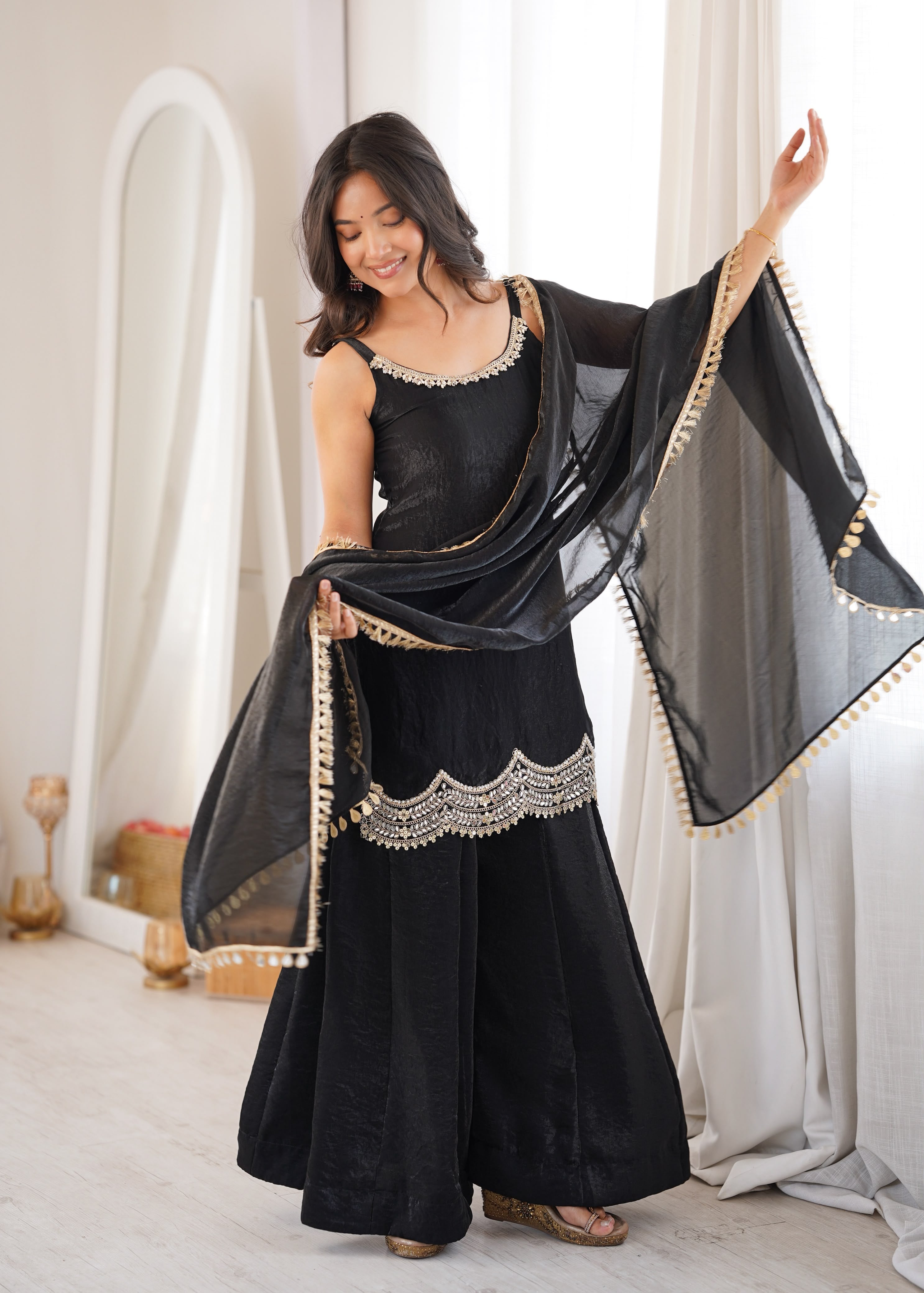Effortless black glam with scallop-border charm.