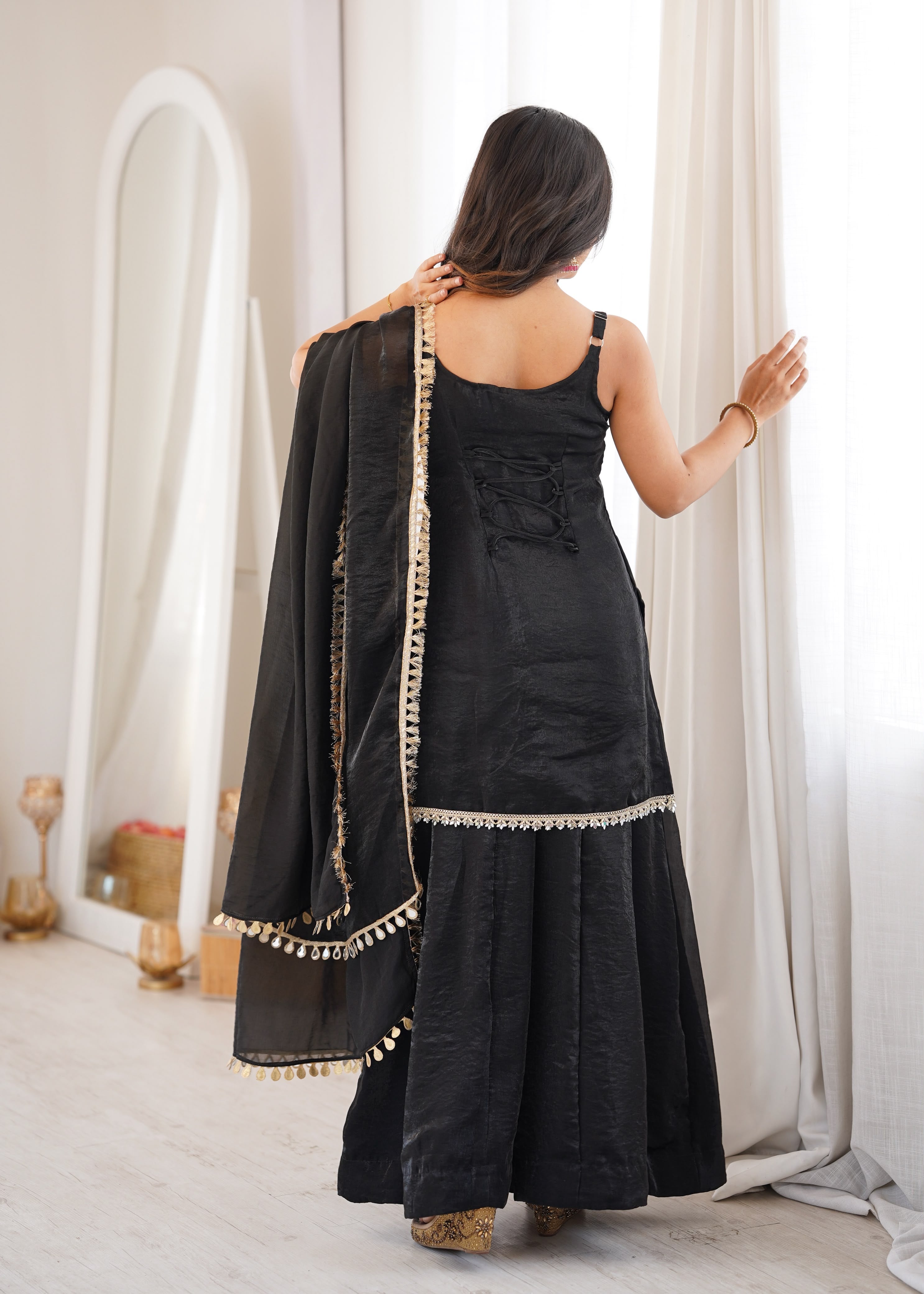 Effortless black glam with scallop-border charm.